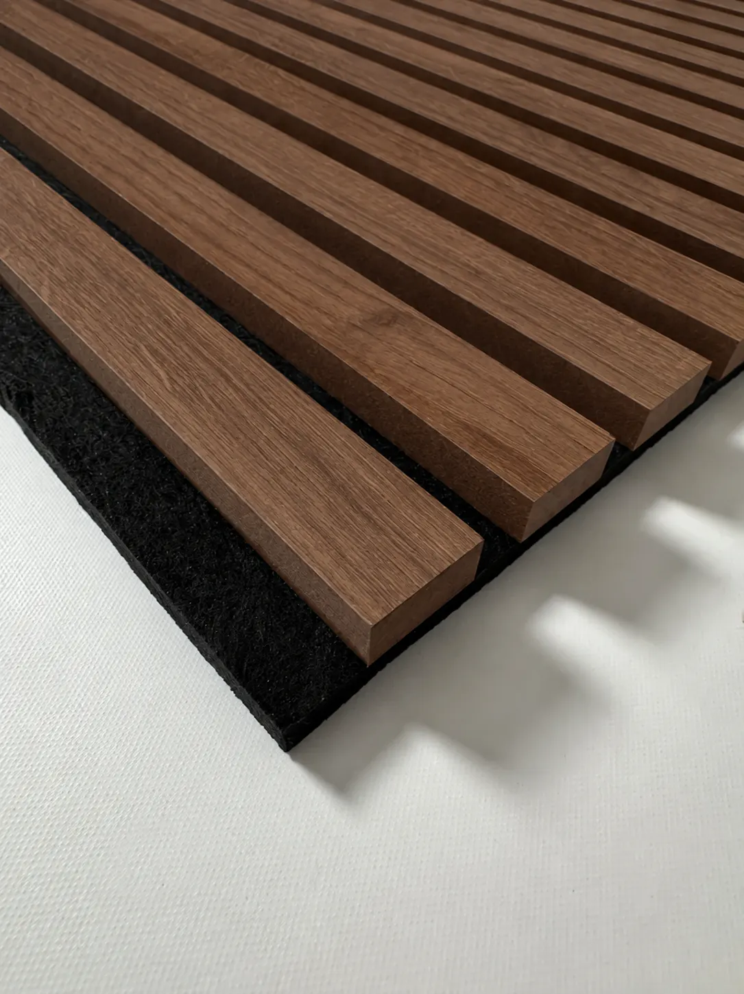 AcoustiSlat panel in the Walnut finish, showing the slats and the acoustic backing