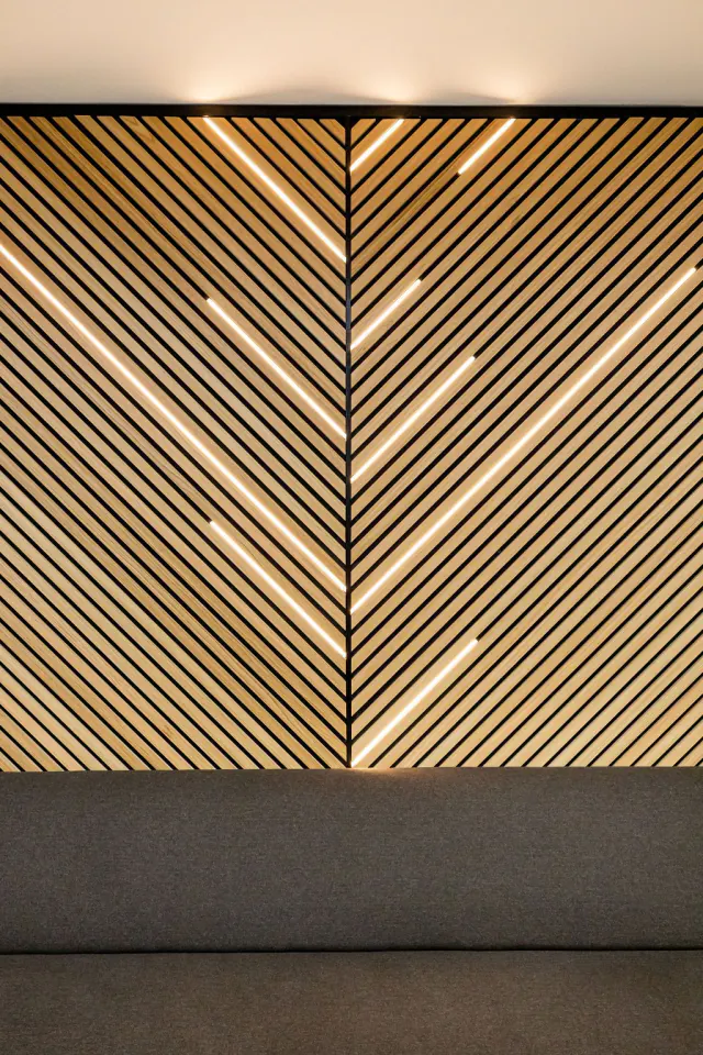 Backlit chevron slat panel detail