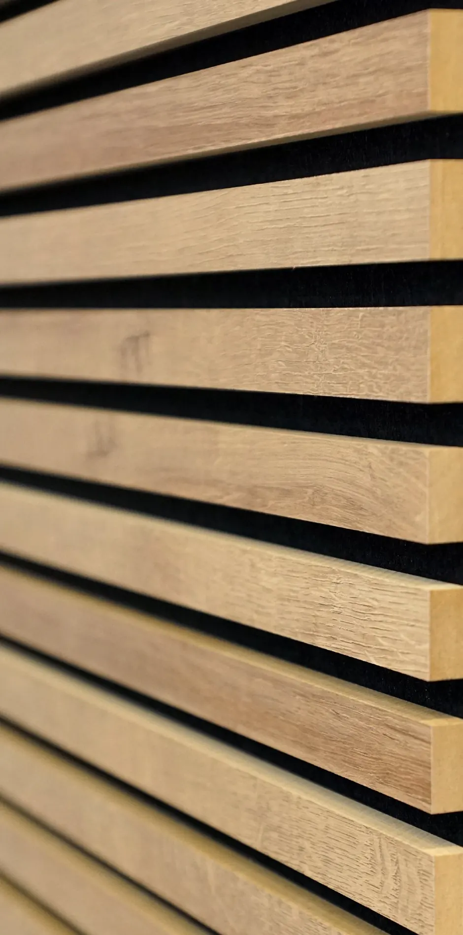Close-up of the milled edge of an AcoustiSlat natural wood-look slat